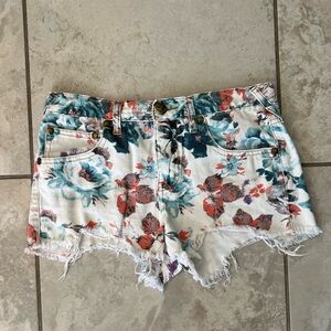 Free People White and Blue Jean Cutoff Shorts with a Turquoise Floral Pattern
